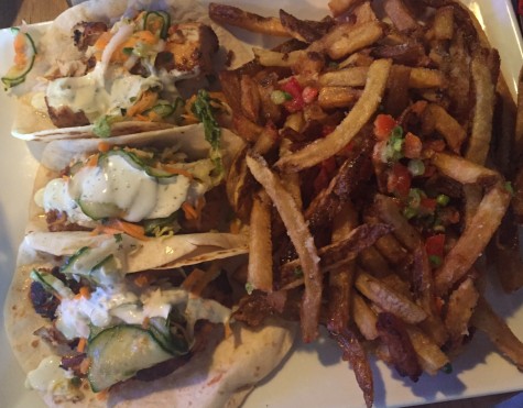 The fish tacos accompanied with truffle fries are unique and filling 