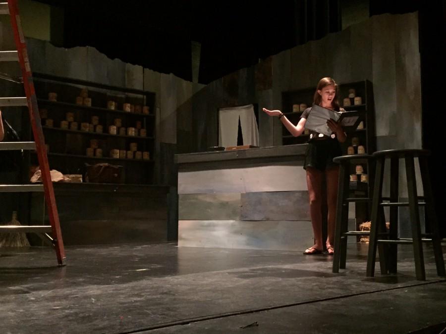 Kayla Hoffman practicing her lines on the auditorium stage