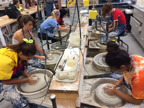 Students in Ceramics race to finish their Homecoming art pieces.