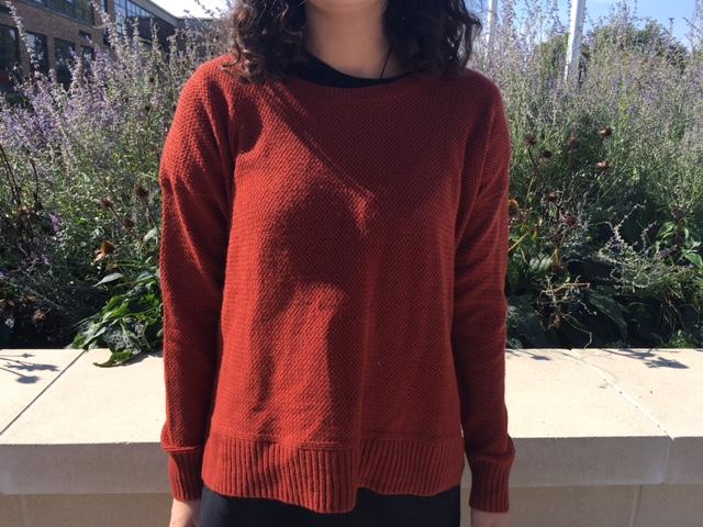 Libby Mccarthy models a burnt orange sweater