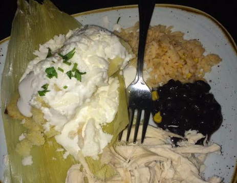 Corn tamale with fresco, chicken, black beans, and Mexican rice.