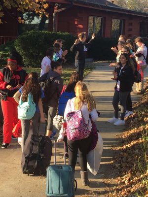 Team leader Zach Wols, senior, directs students to their cabins and sleep arrangements. 